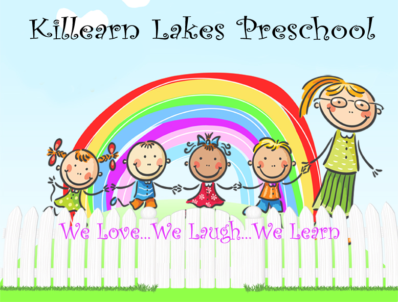 boys and girls holding hands with a teacher all smiling in front of a rainbox