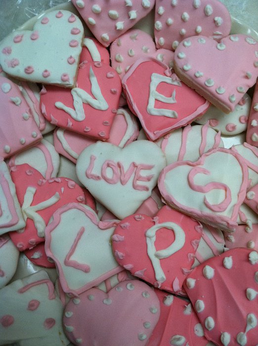 candy hearts with letters reading we love KLPS